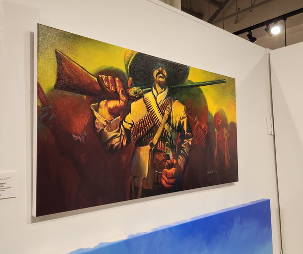 Gabe Leonard's artwork of four Vaquero. One is centered and holding a rifle over his right shoulder. His left hand is holding a knife in its holster on his left hip.